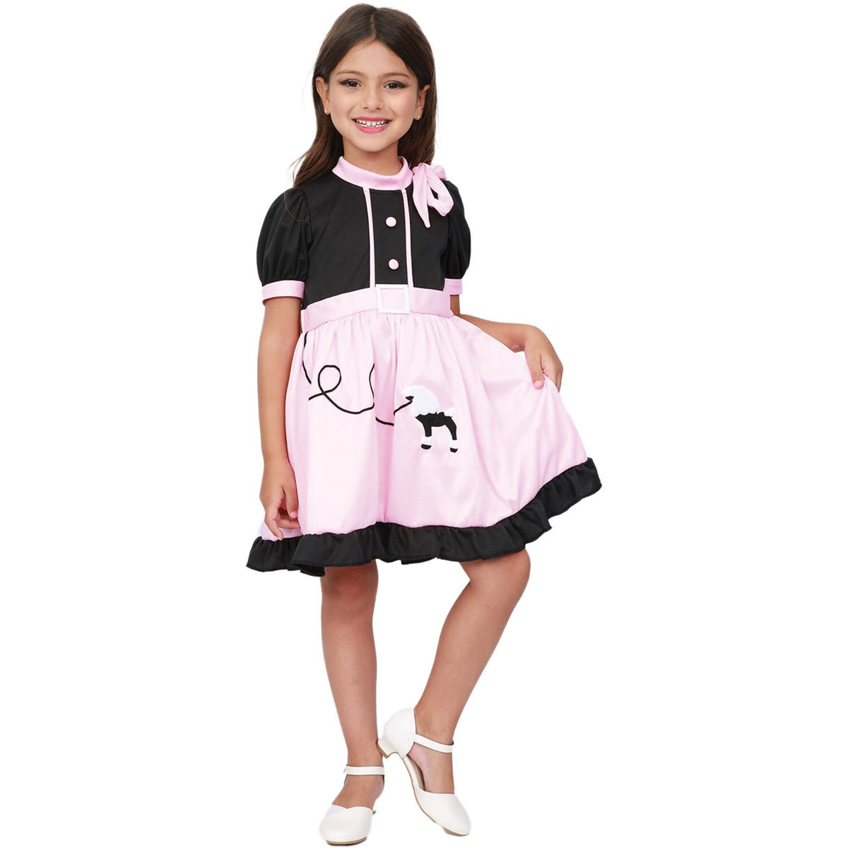 Model wearing Lola Stars teen girls' 50s costume: black and pink poodle dress with ruffled hem and pink neck scarf