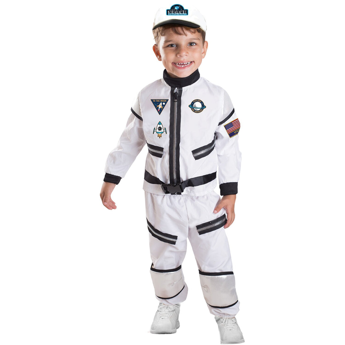 Model wearing Lola Stars toddler astronaut costume: white shirt with mission patches, striped white pants and white cap