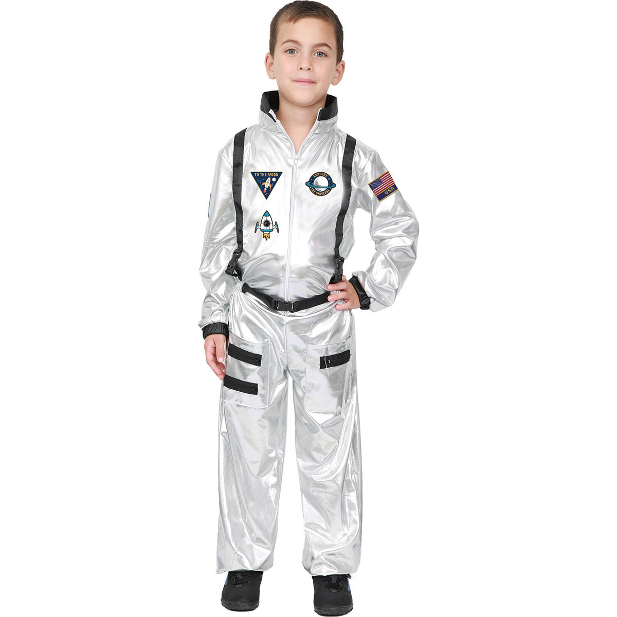Model wearing Lola Stars boys' astronaut costume: metallic silver jumpsuit with patches and black straps