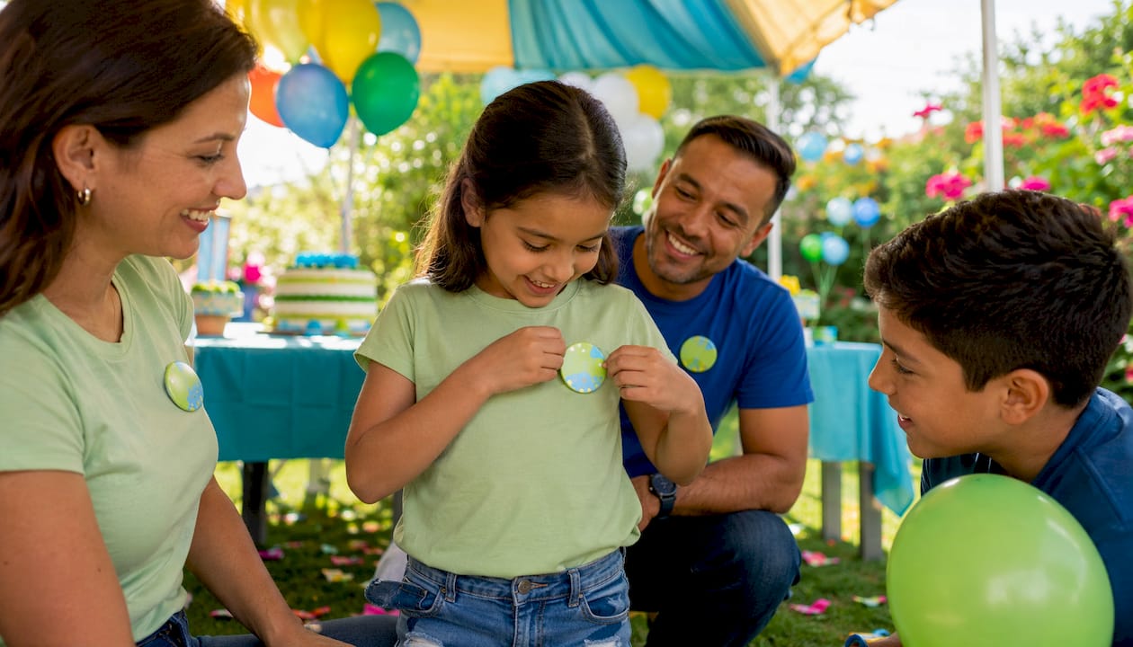 Child pinning personalized birthday button at party