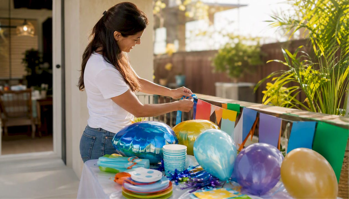 Hands assembling party decorations on table