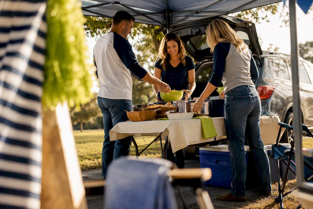 Friends arranging a colorful tailgate party