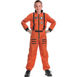 Model wearing Lola Stars boys' astronaut costume: bright orange jumpsuit with black straps and mission patches