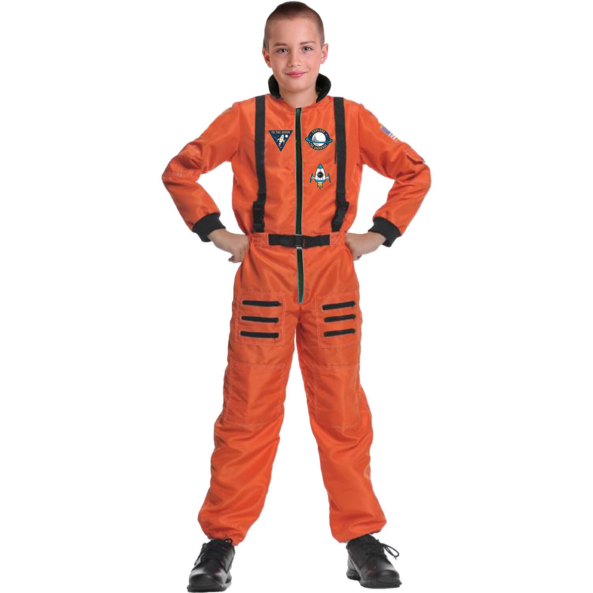 Model wearing Lola Stars boys' astronaut costume: bright orange jumpsuit with black straps and mission patches